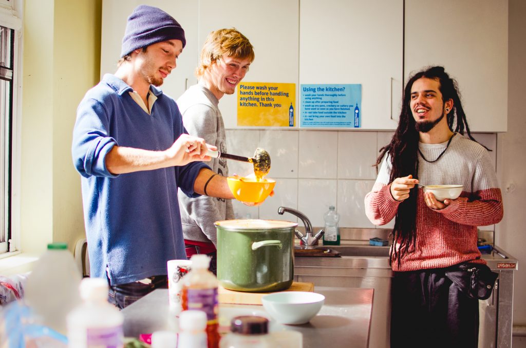 Young people making soup together